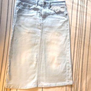 The Skirt outlet Hailee light denim midi skirt.